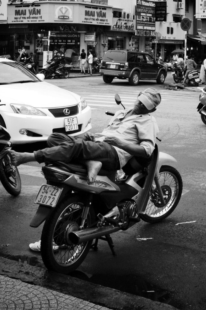 Resting biker in Ho Chi Minh City, Vietnam